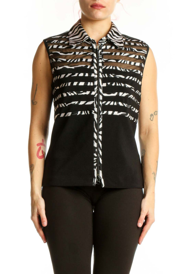 Black and white zebra stripe sleeveless button-up top by Joseph Ribkoff, front view on model