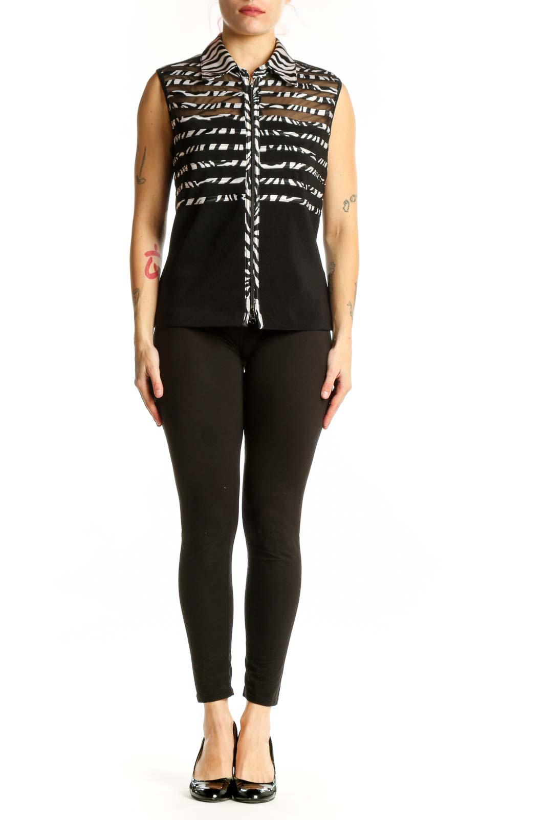 Black and white zebra stripe sleeveless button-up top by Joseph Ribkoff, front view on model