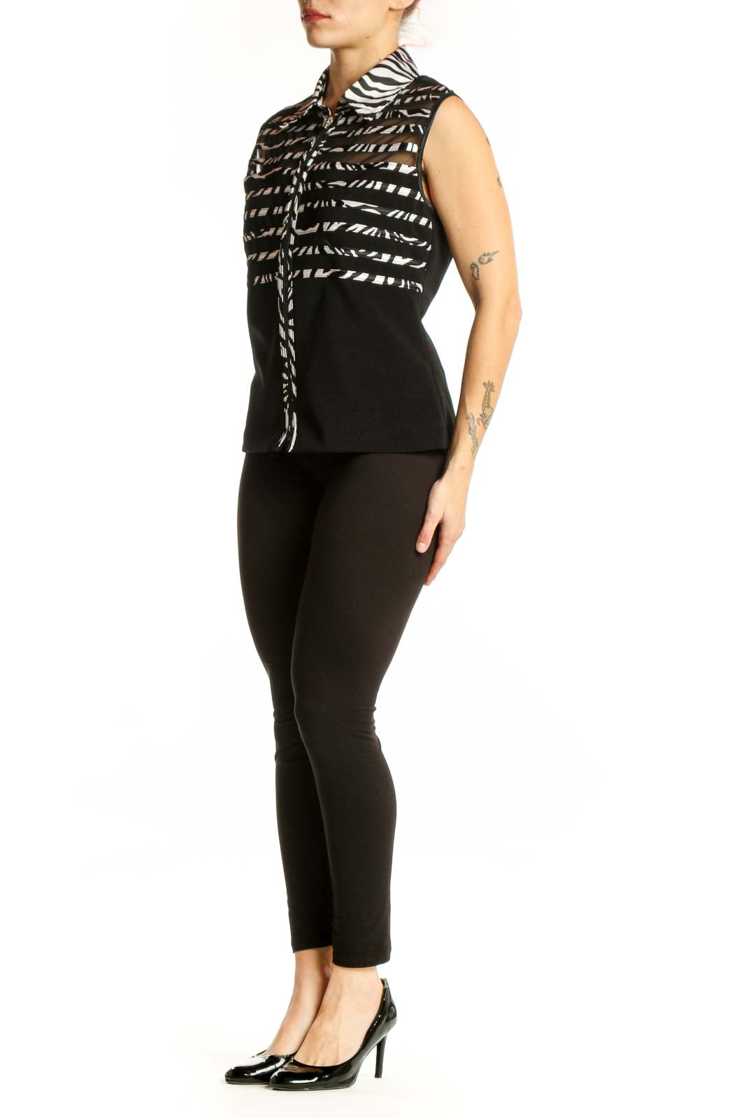 Black and white zebra stripe sleeveless button-up top by Joseph Ribkoff, front view on model