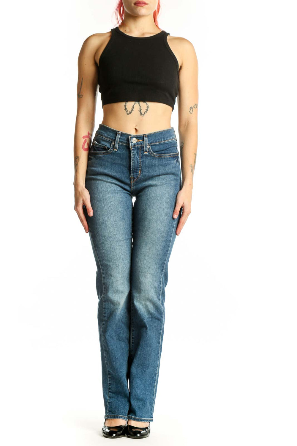 Front view of blue Levi's bootcut jeans on model, size S, showing classic five-pocket design and mid-rise fit