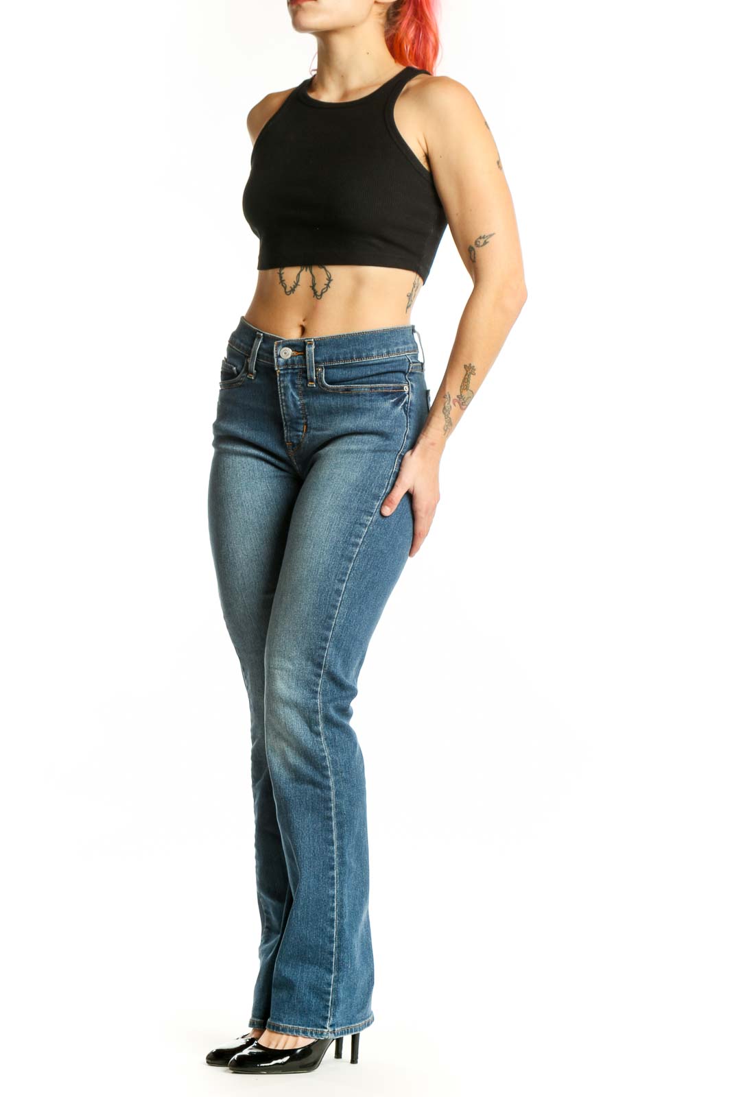 Front view of blue Levi's bootcut jeans on model, size S, showing classic five-pocket design and mid-rise fit