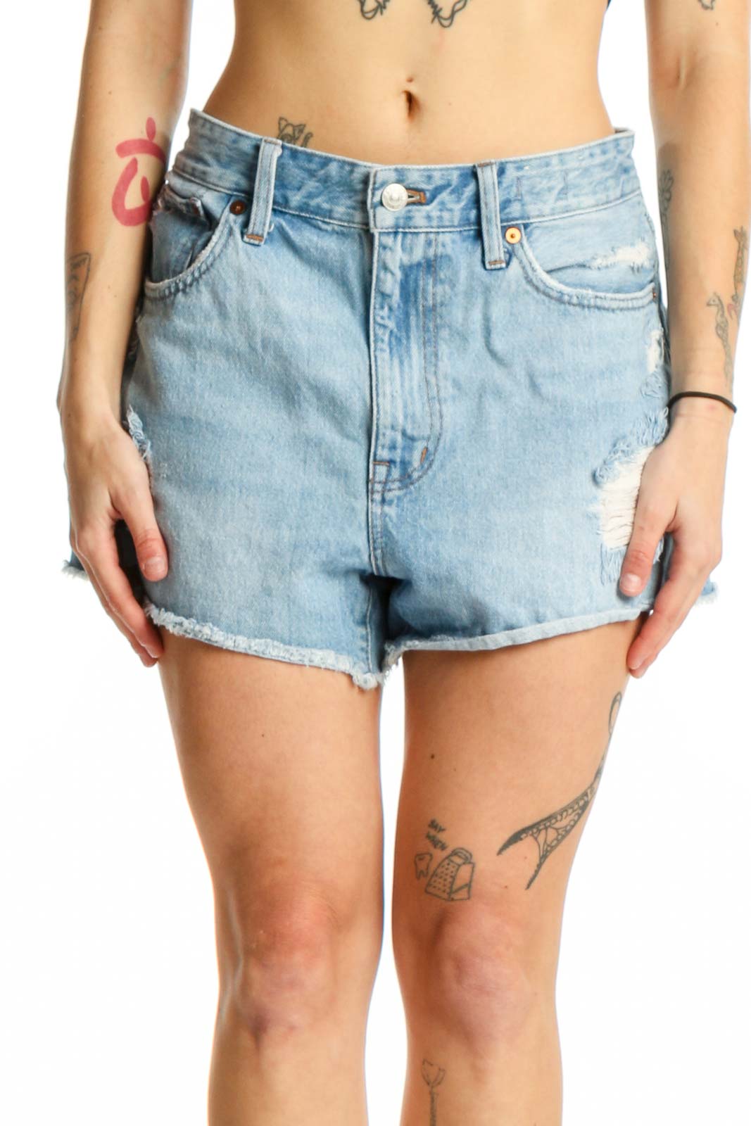 Light blue distressed denim shorts with raw-cut hem and five-pocket design, front view