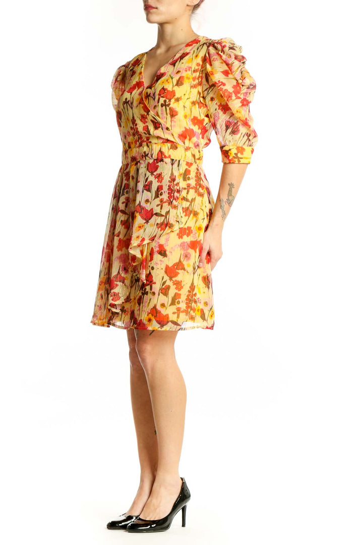 Red and yellow floral Walter Baker dress with puffed three-quarter sleeves and wrap V-neckline, front view