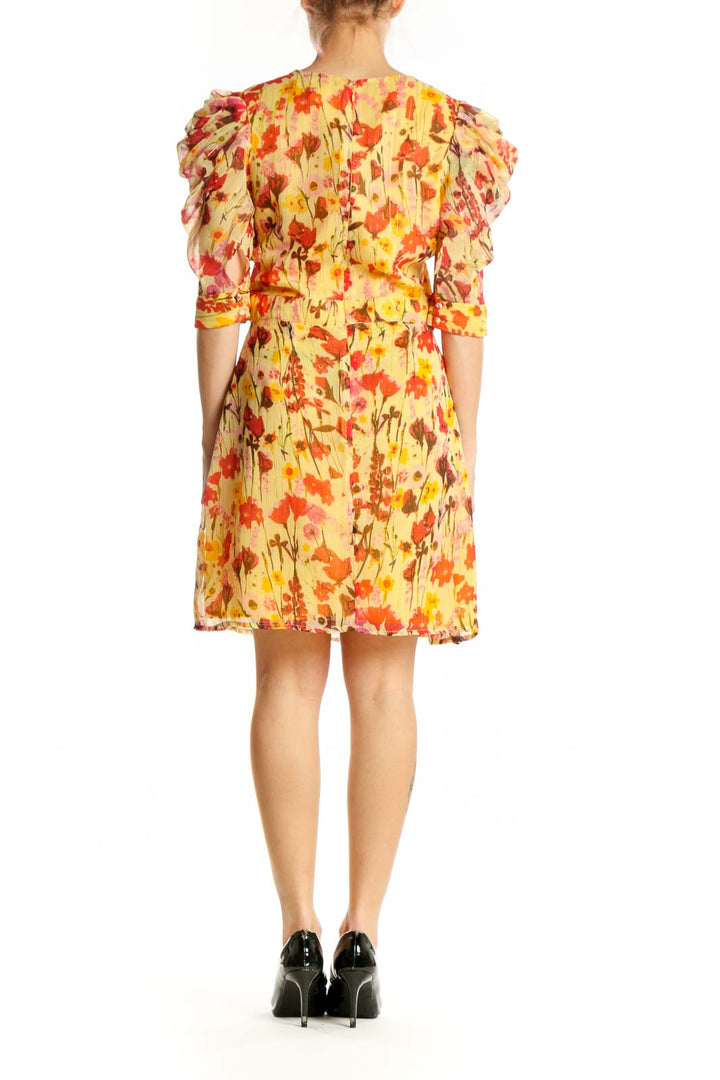 Red and yellow floral Walter Baker dress with gathered waist and A-line skirt, back view