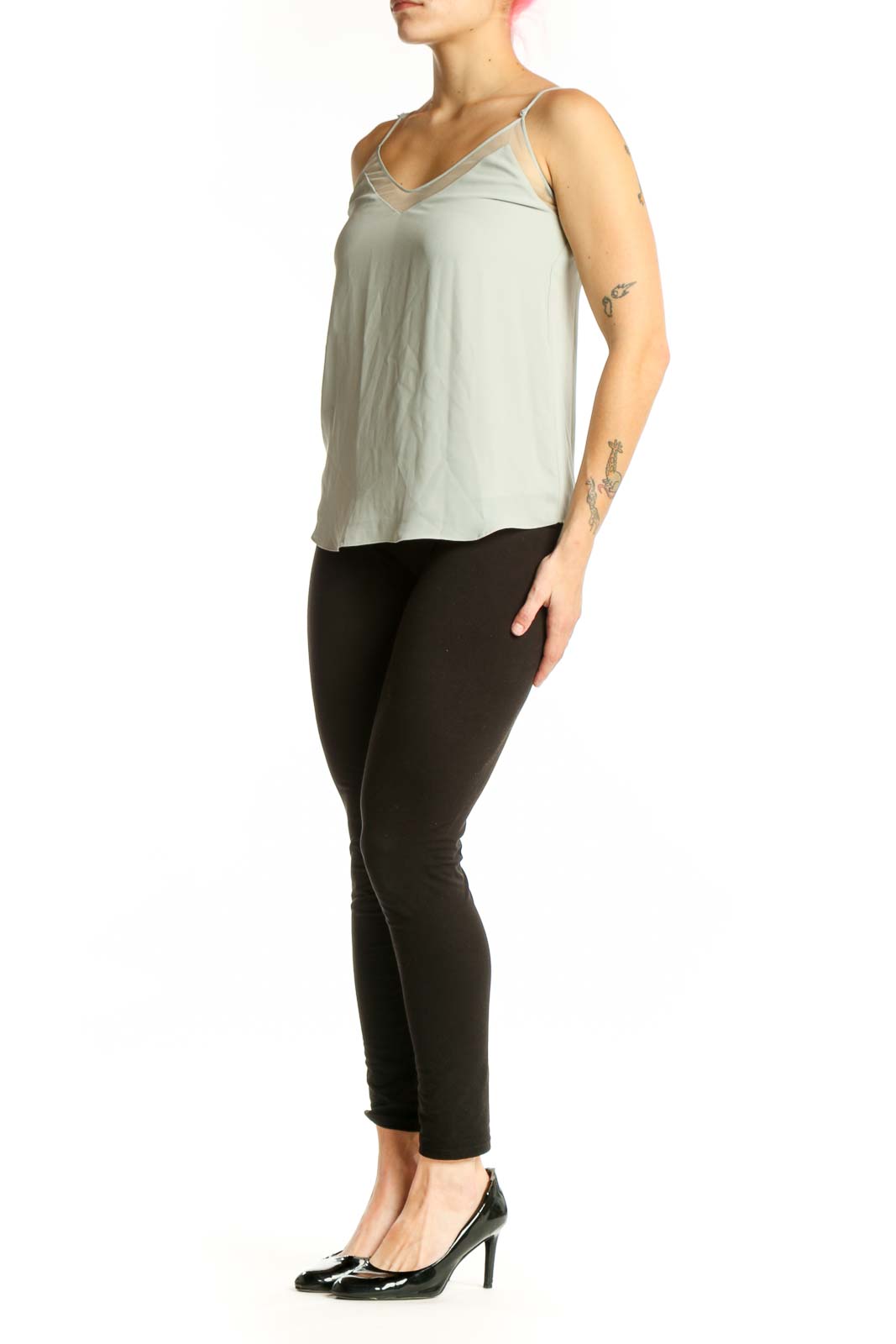 Cream camisole tank top with V-neckline and adjustable spaghetti straps, front view