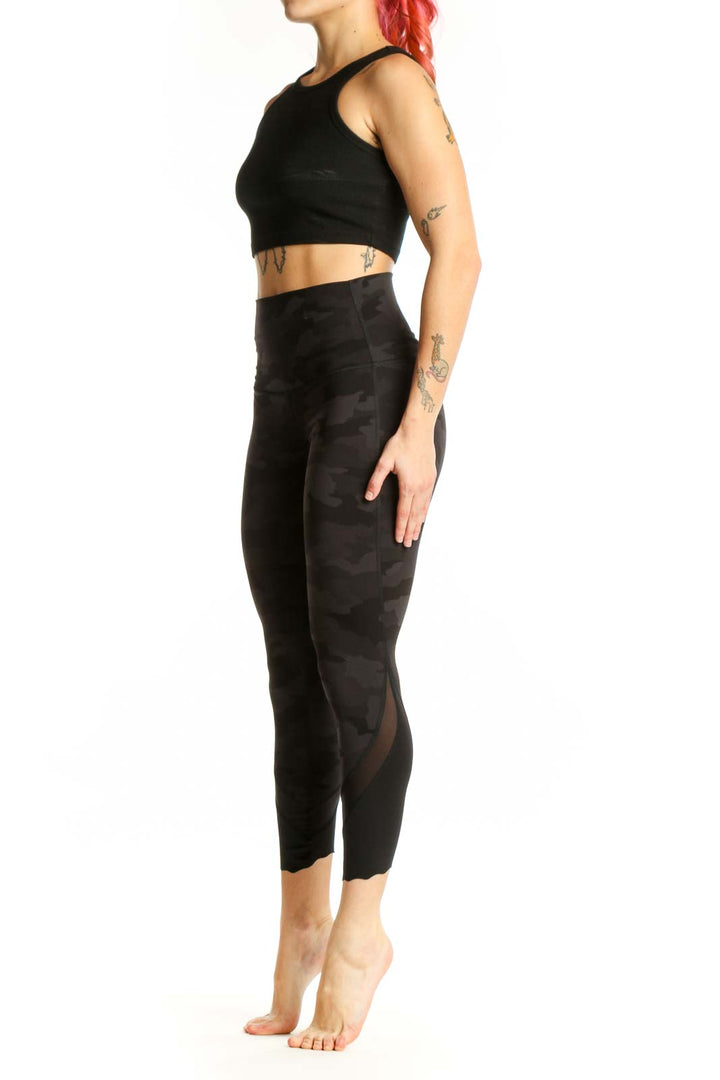Black camouflage capri leggings with high-waisted design, front view