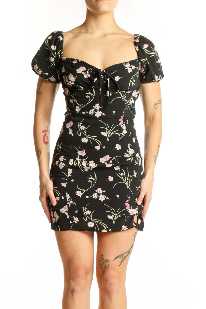 Black floral mini dress with puffed sleeves and sweetheart neckline, front view