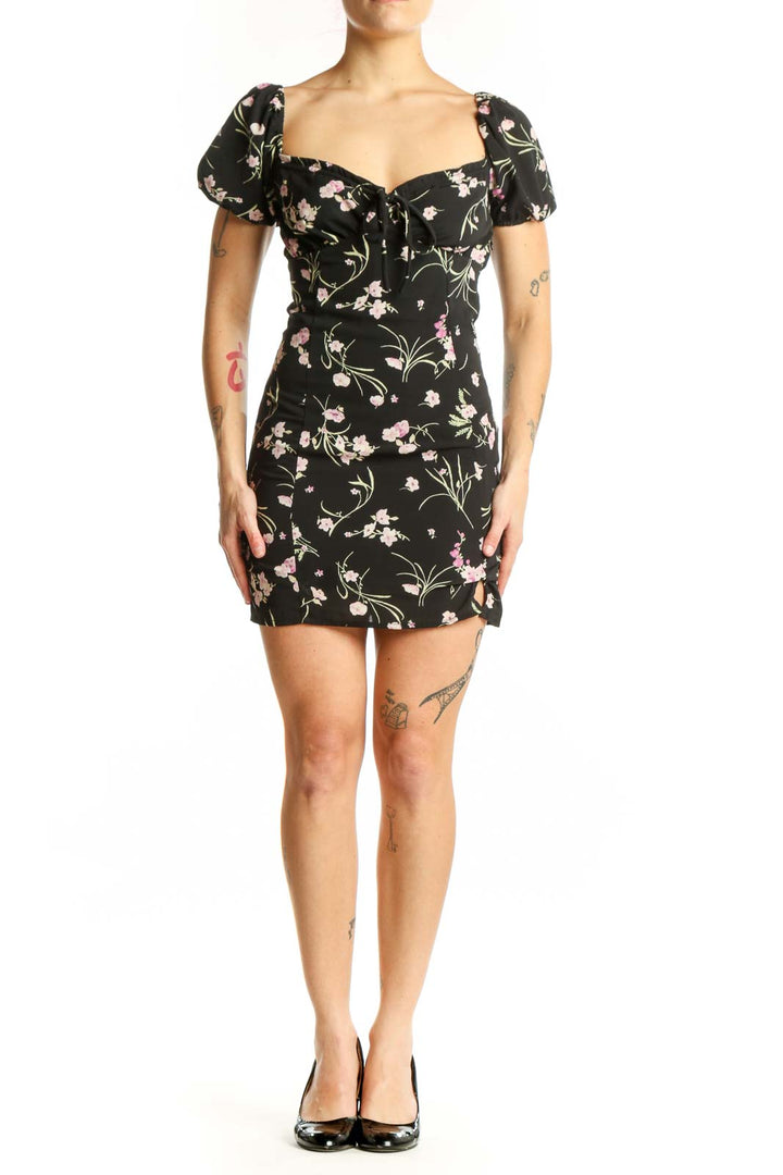Black floral mini dress with puffed sleeves and sweetheart neckline, front view