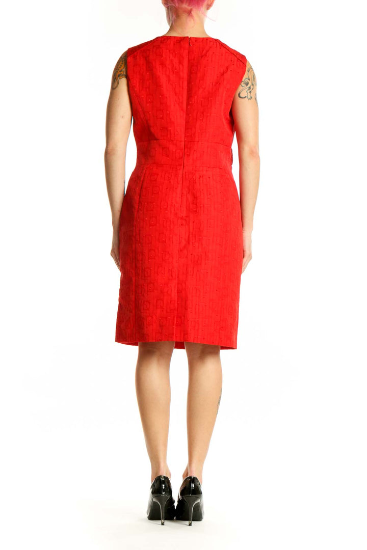 Red sleeveless belted A-line dress by Tahari with decorative gold buckle, back view