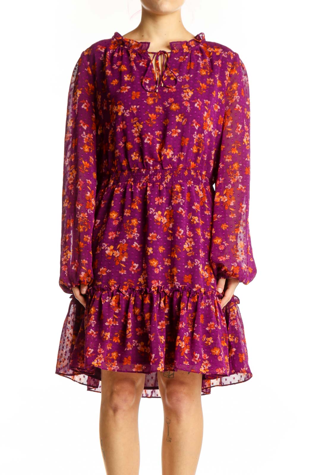 Purple floral long sleeve dress with golden yellow print, keyhole neckline, and tiered ruffle hem - front view