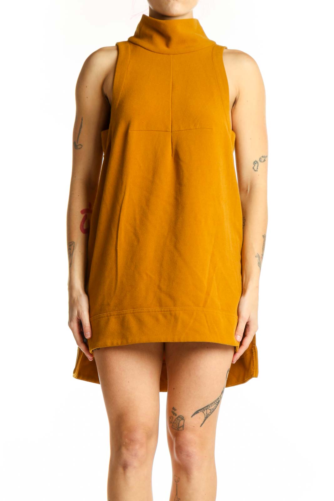 Gold turtleneck sleeveless A-line dress front view on model