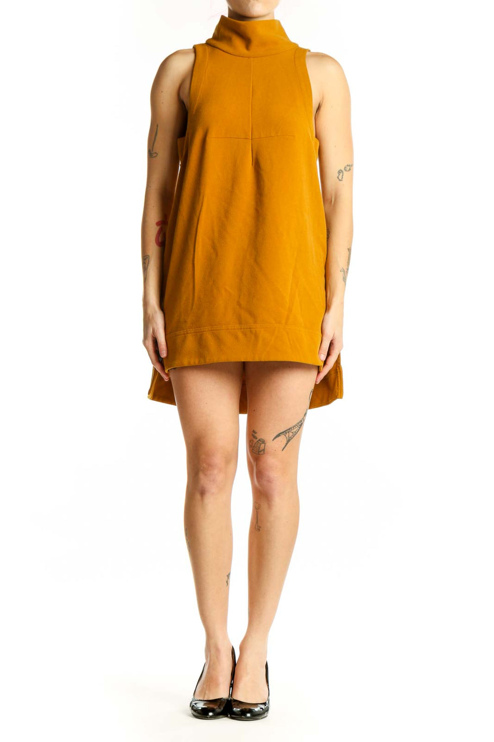 Gold turtleneck sleeveless A-line dress front view on model