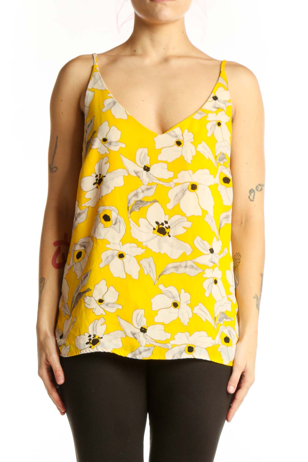 Yellow floral cami tank top with white daisy print and V-neckline, front view