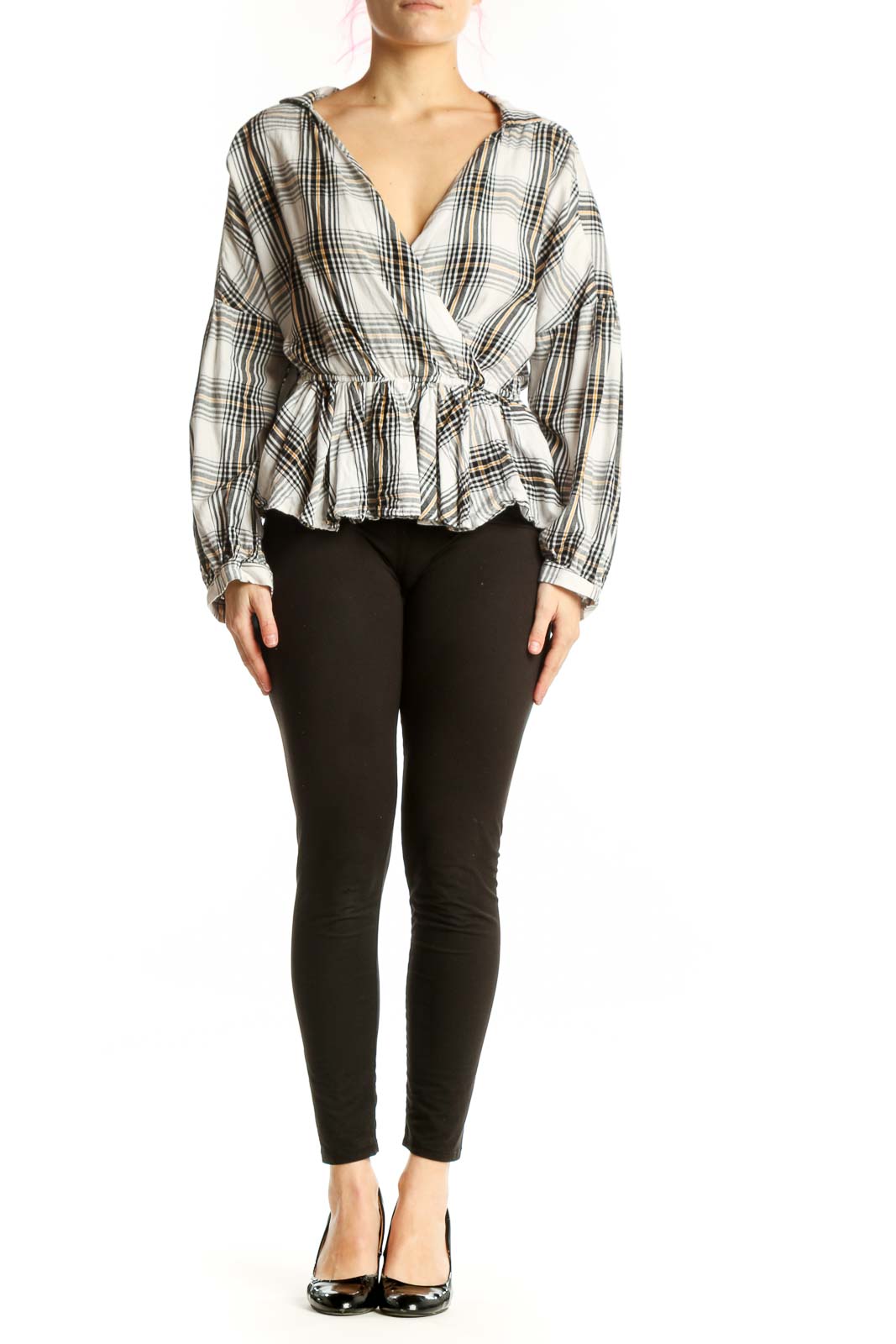 White and black plaid wrap top with peplum hem and long sleeves, front view