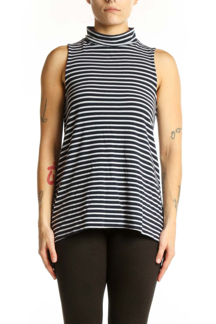 Navy and white horizontally striped Athleta turtleneck tank top front view on model