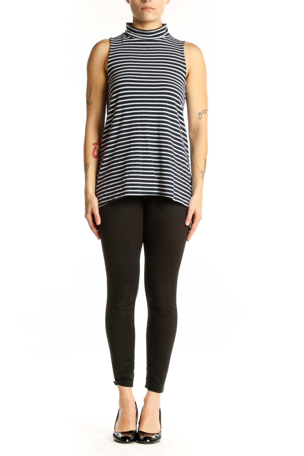 Navy and white horizontally striped Athleta turtleneck tank top front view on model