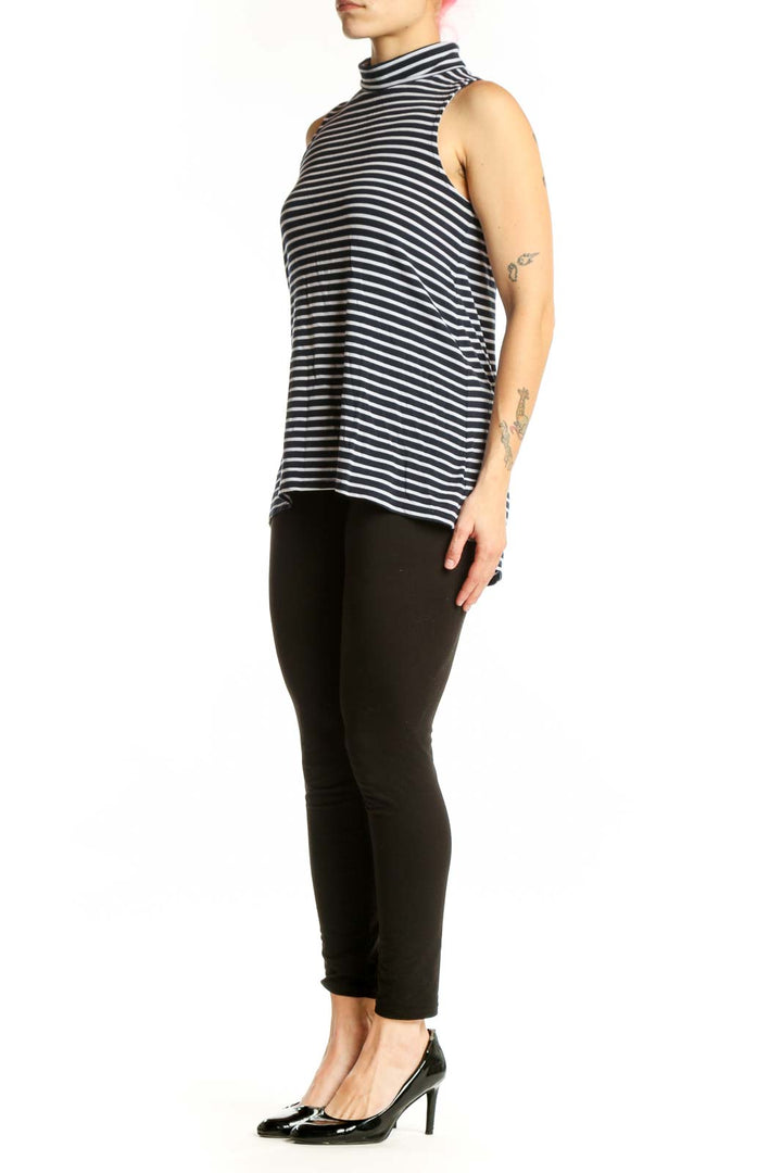 Navy and white horizontally striped Athleta turtleneck tank top front view on model