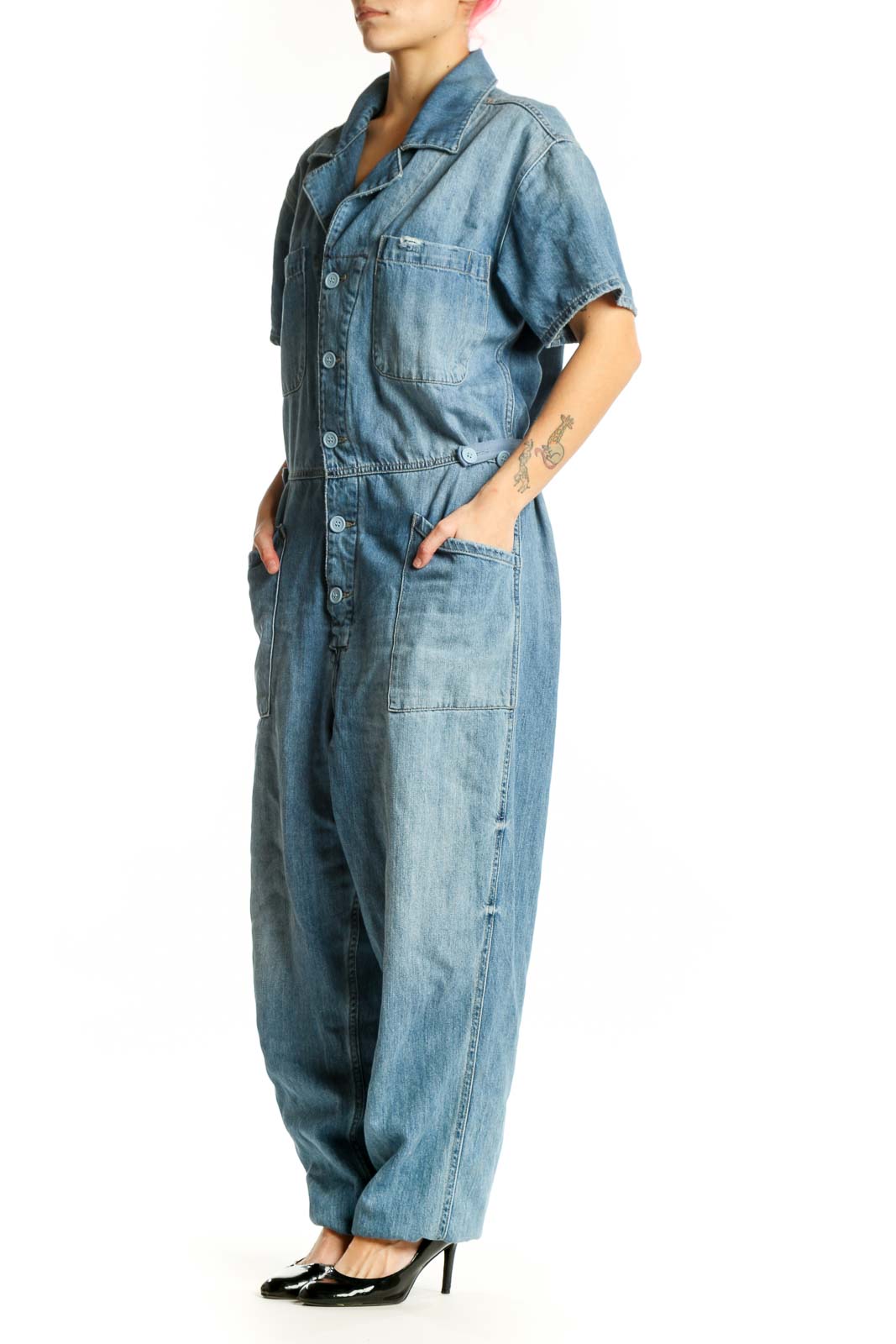 Pistola blue denim short sleeve jumpsuit with button-front closure and chest pockets, front view