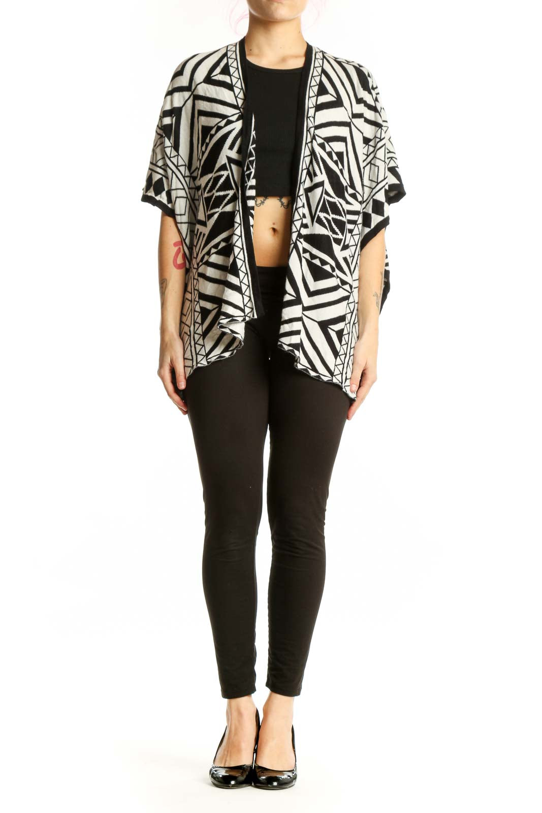 Black and white geometric kimono cardigan with abstract pattern, open front design, worn over black top