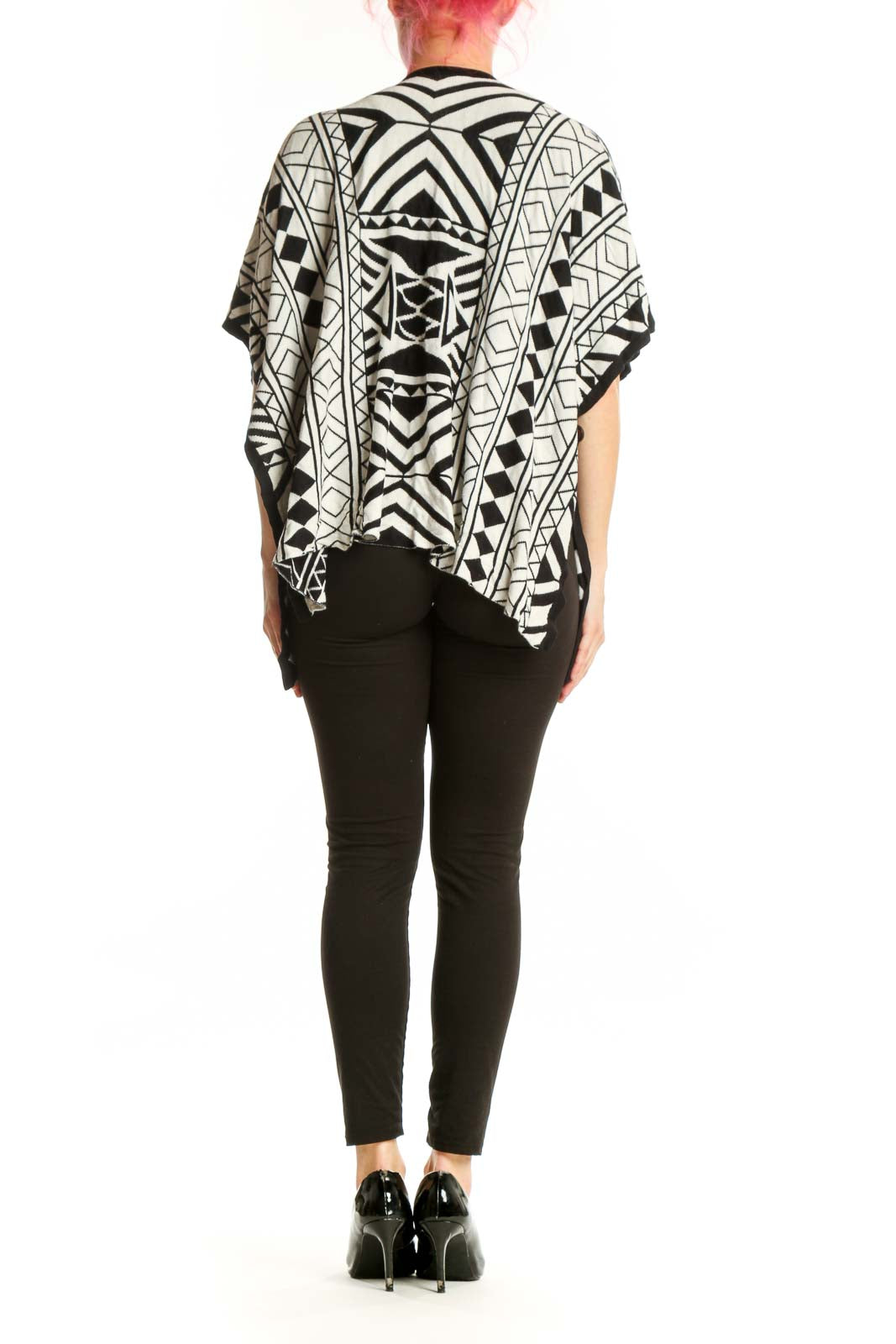 Back view of black and white geometric kimono cardigan showing full pattern and relaxed draping silhouette