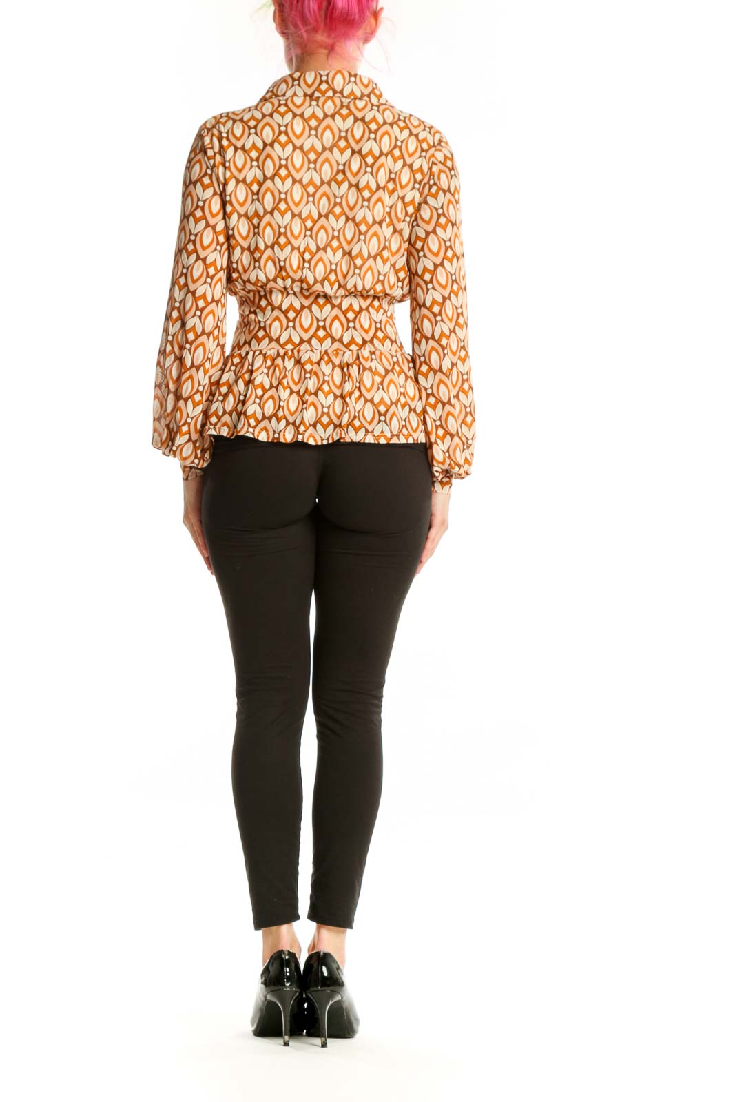 Back view of orange geometric print wrap blouse showing gathered waist and balloon sleeve detail