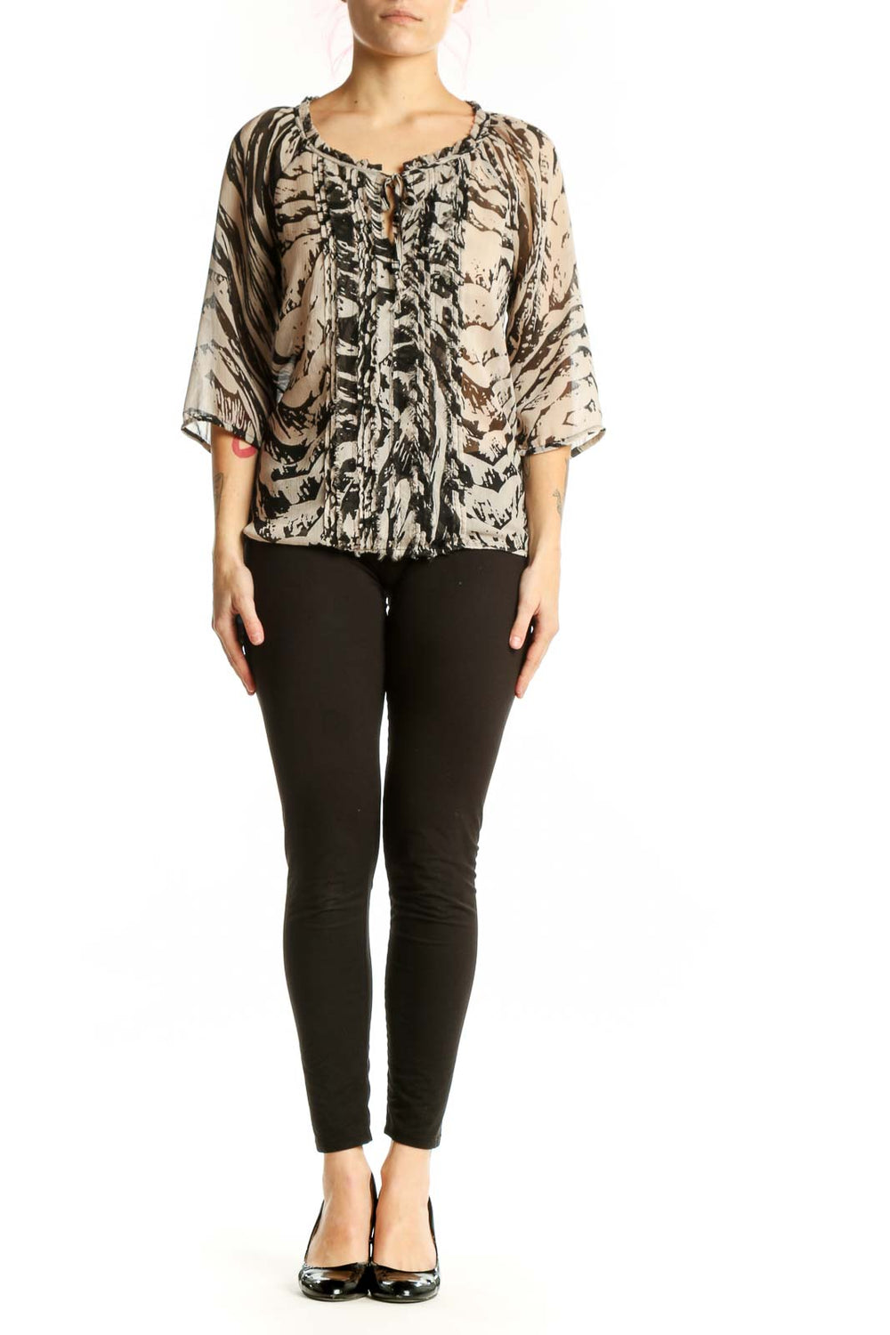 Cream and black abstract print Express blouse with ruched front detail and tie neckline, worn with black pants