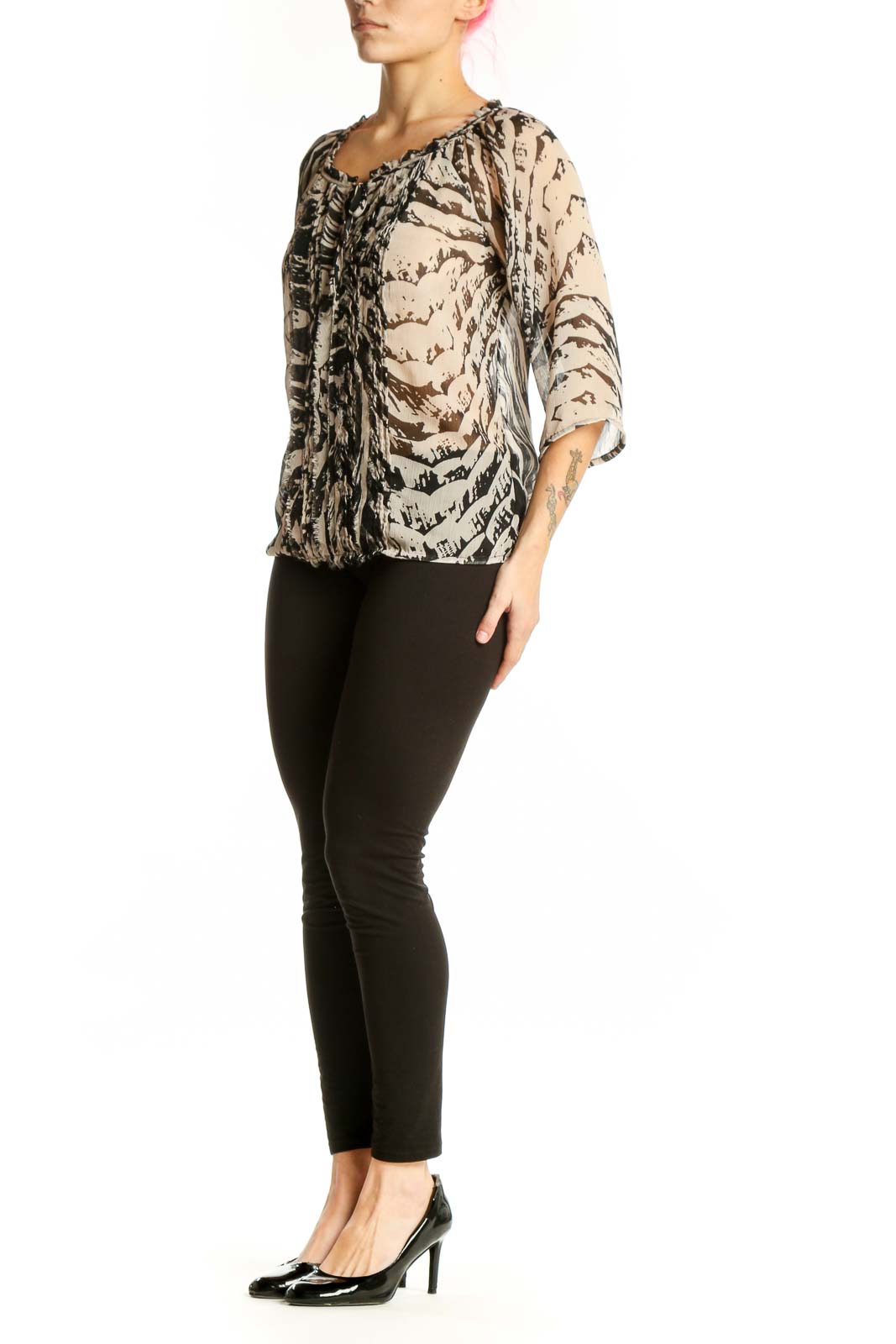 Cream and black abstract print Express blouse with ruched front detail and tie neckline, worn with black pants