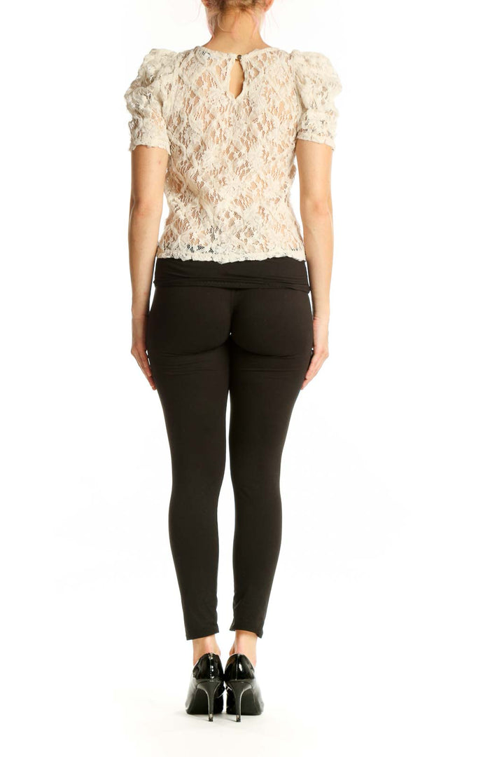 Cream lace puff sleeve top with all-over lace detailing, back view showing cropped silhouette