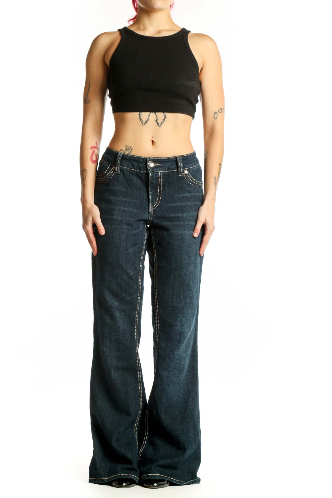 Front view of dark blue denim flare jeans with contrast stitching and mid-rise waist