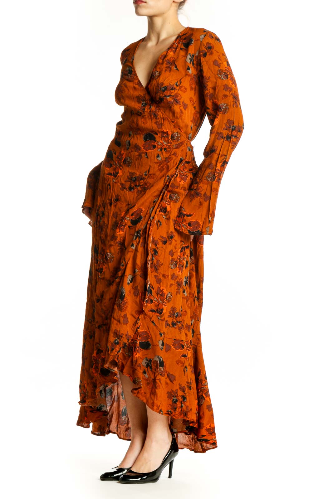 Front view of orange floral wrap dress with long sleeves and asymmetrical maxi hemline