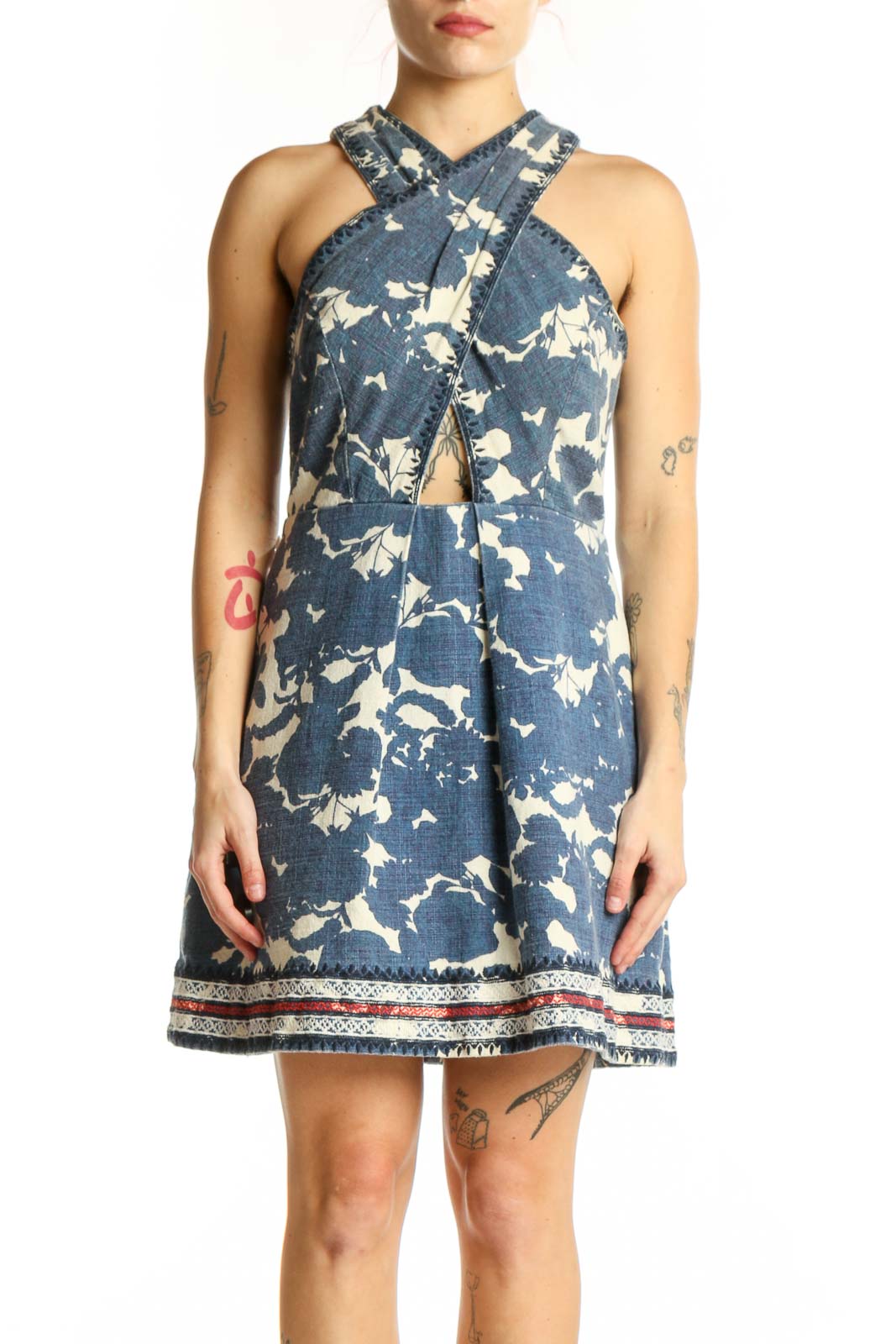 Navy floral halter dress with cream botanical print and cutout detail, front view