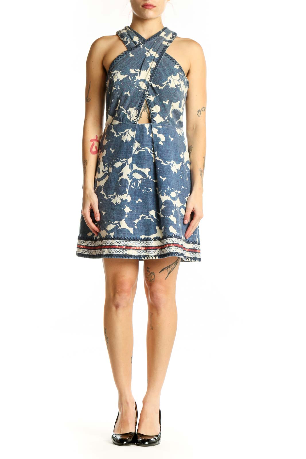Navy floral halter dress with cream botanical print and cutout detail, front view
