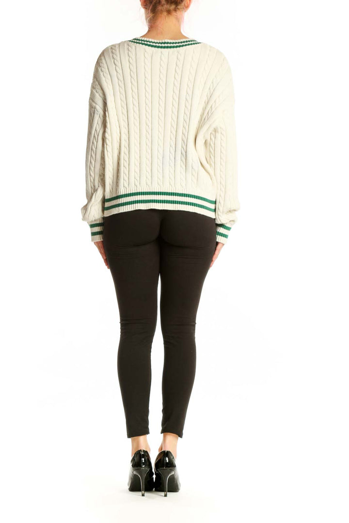 Cream cable knit v-neck pullover sweater with green and white striped trim, back view