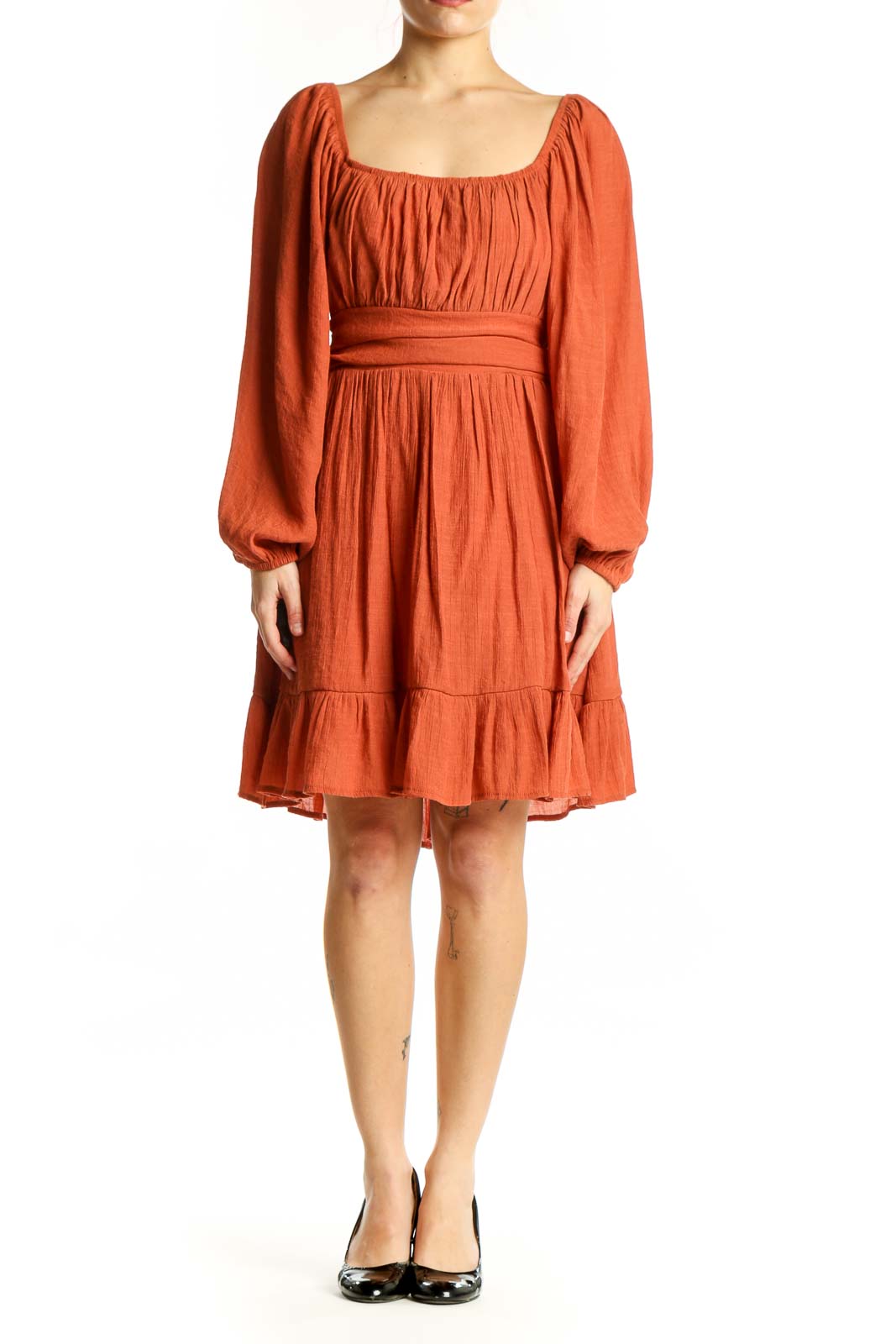Front view of orange puff sleeve empire waist dress with gathered neckline and tiered ruffle hem