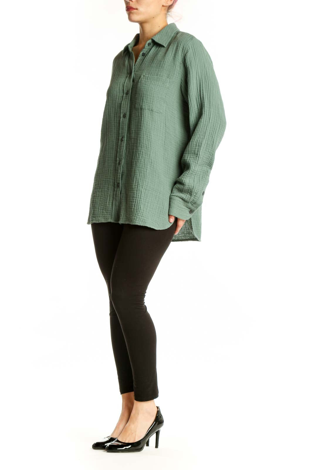Sage green cotton button-up shirt with collar and chest pocket, front view on model