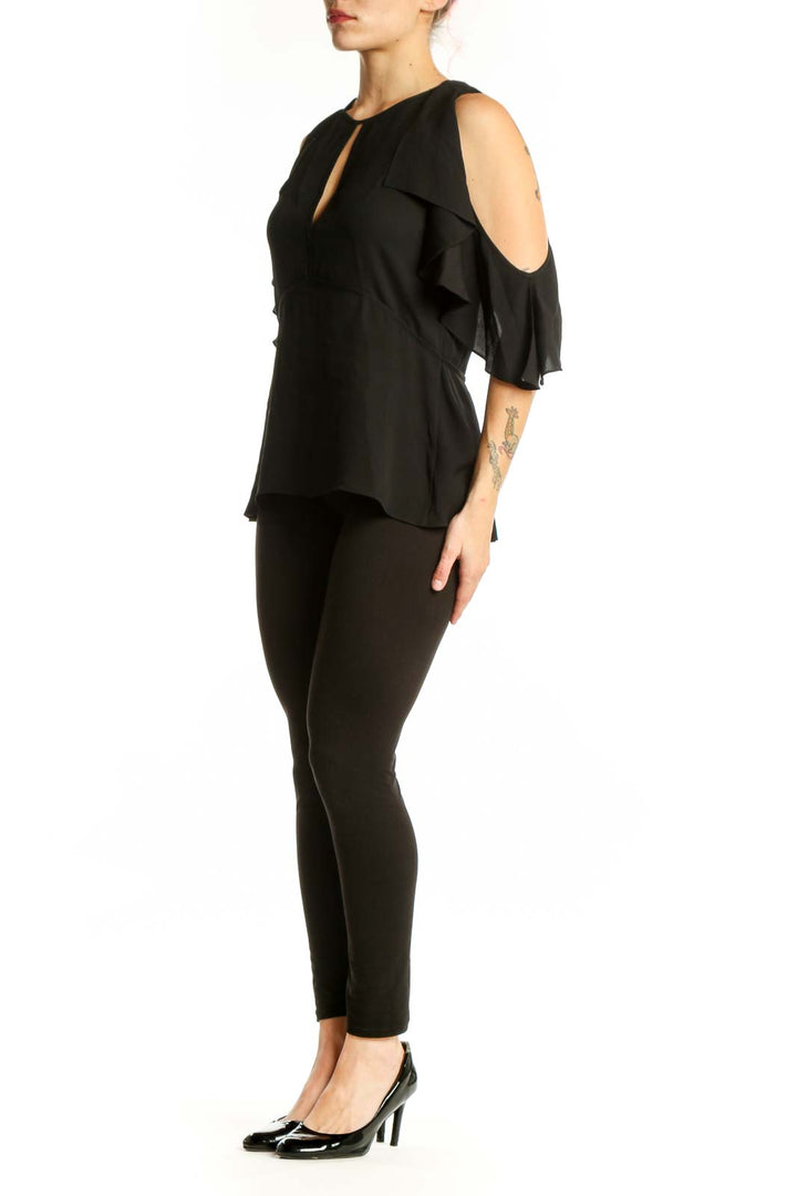 Black silk cold shoulder top with ruffled sleeves and keyhole neckline by Theory, front view