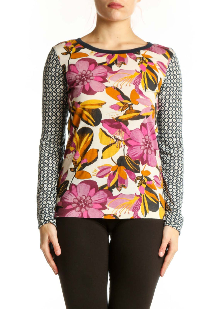 Tory Burch multicolor floral long sleeve top with geometric patterned sleeves, front view on model