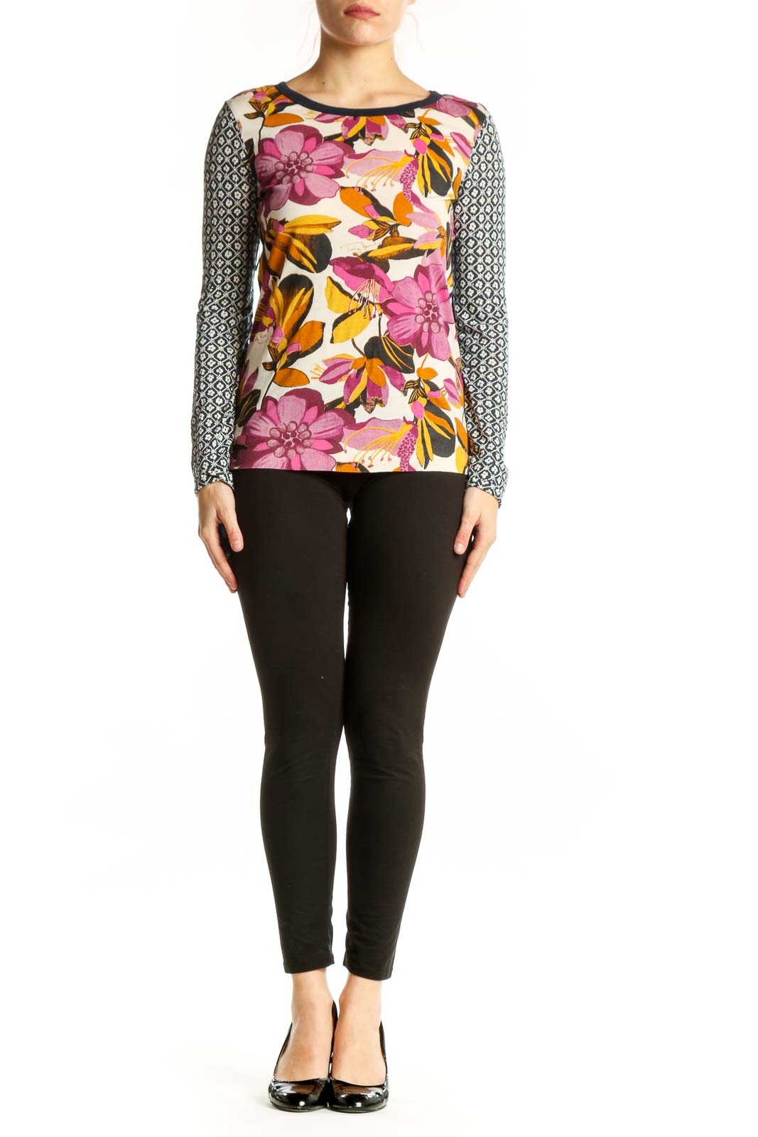 Tory Burch multicolor floral long sleeve top with geometric patterned sleeves, front view on model