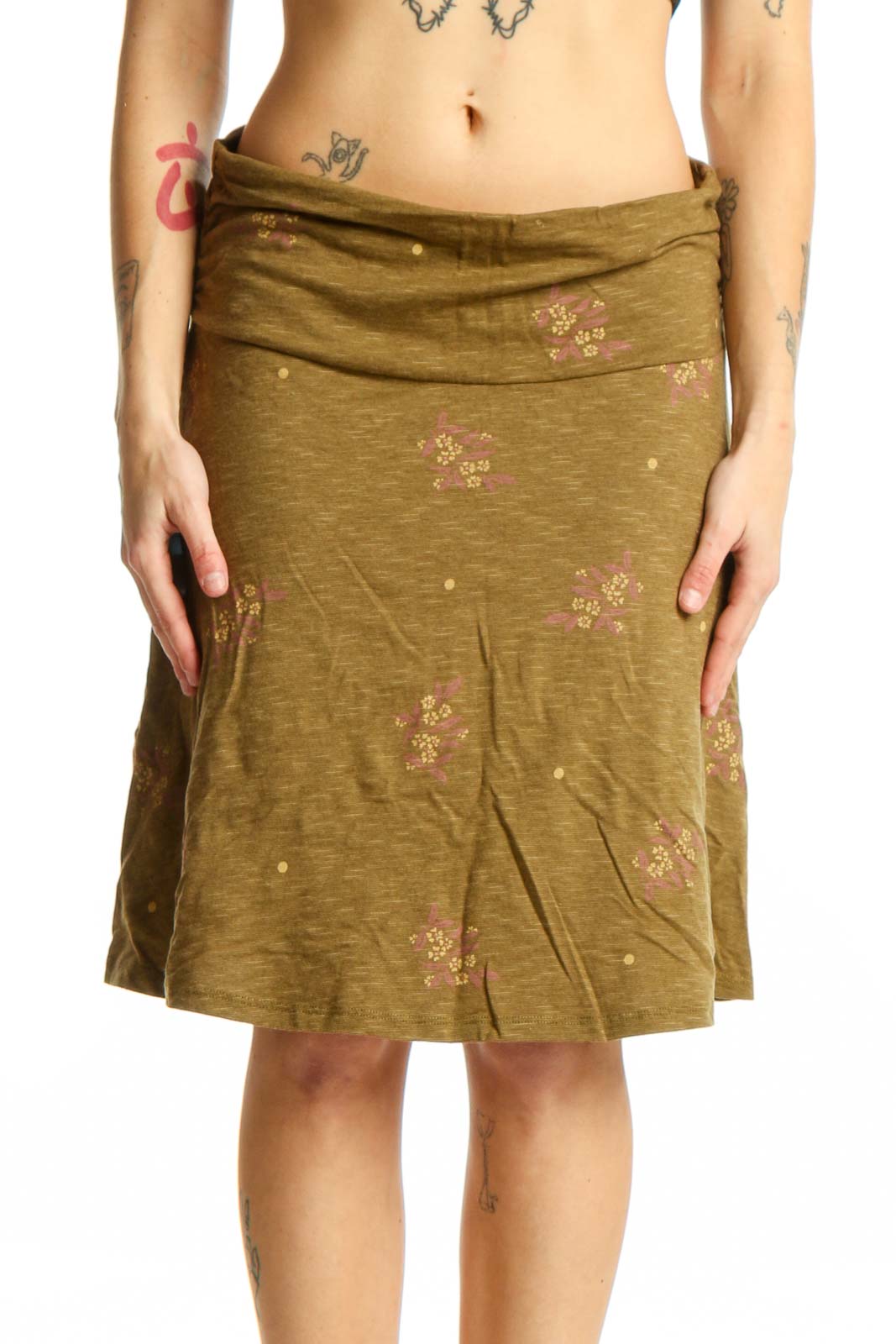 Olive green A-line skirt with pink and cream floral embroidery, wrap waistband, knee-length, front view