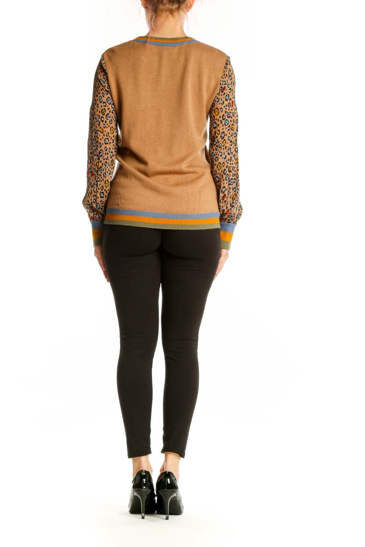 Camel and leopard print colorblock sweater with striped cuff details, back view