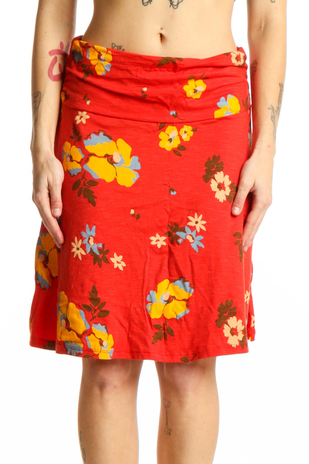 Red floral wrap skirt with multicolor flowers, adjustable tie waist, and A-line silhouette