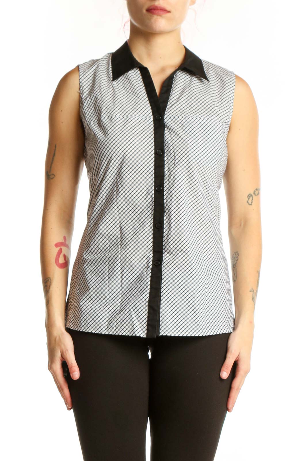 White diagonal striped sleeveless button-up top with black collar trim and contrasting black front placket, front view