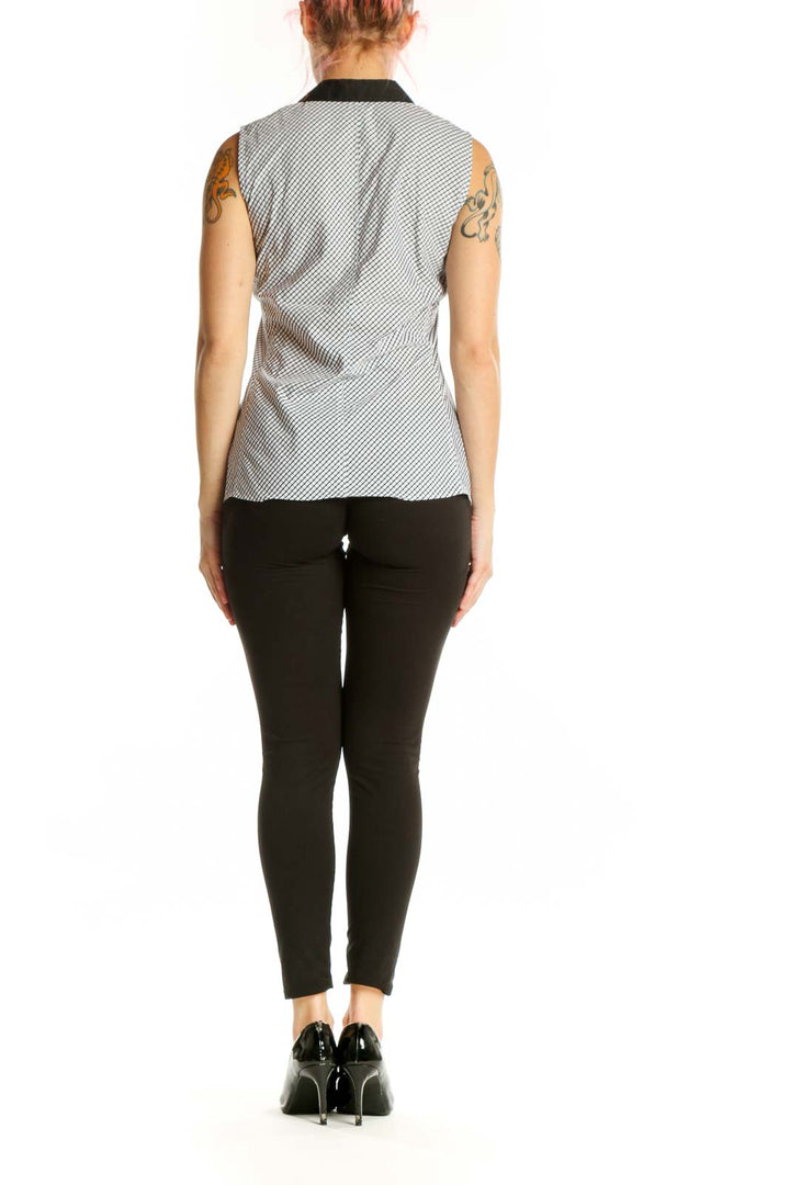 White diagonal striped sleeveless button-up top with black collar trim, back view showing structured fit