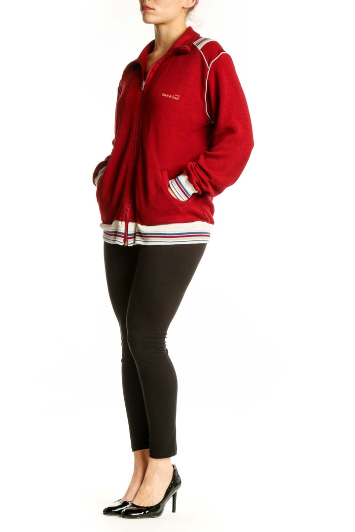 Red velvet varsity track jacket with white and navy striped trim, full-zip closure, and collared neckline