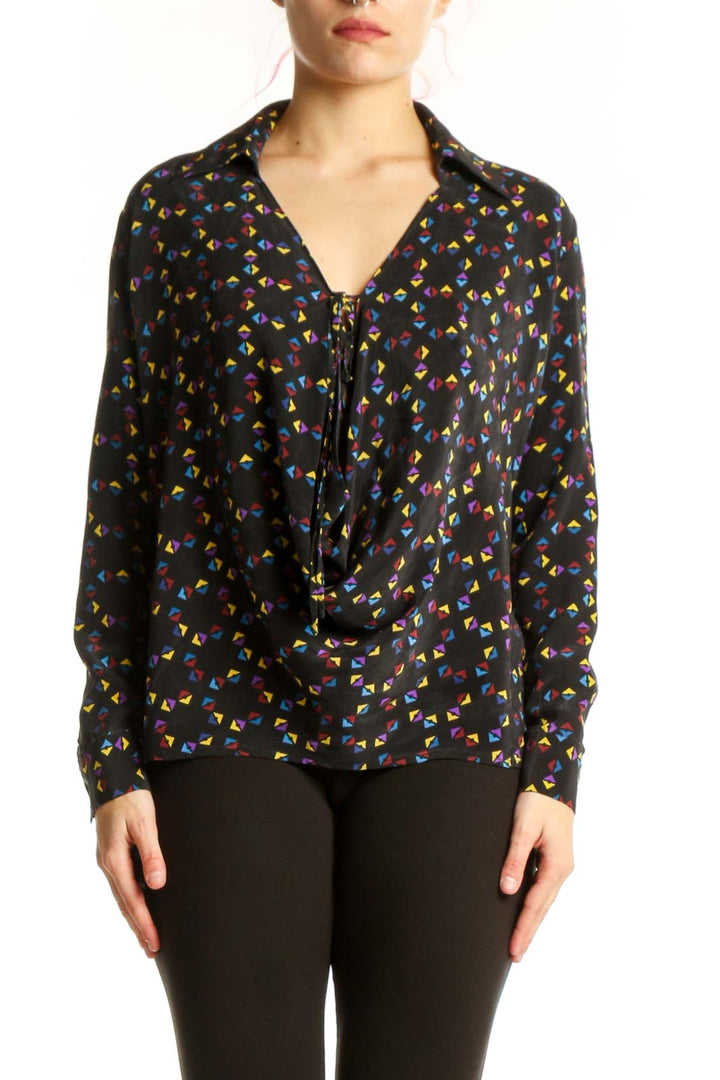 Black silk blouse with multicolor floral print, button-front closure and tie neckline detail by Derek Lam