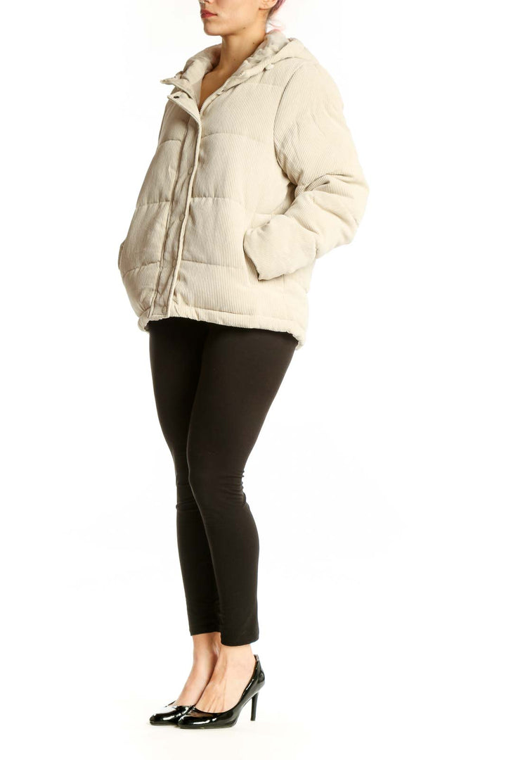 SilkRoll cream quilted puffer jacket with drawstring hood, front view on model