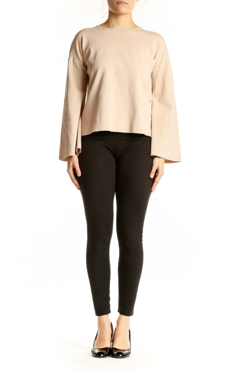 Cream bell sleeve cropped top by Topshop worn with black pants, front view showing relaxed fit and bell sleeve detail