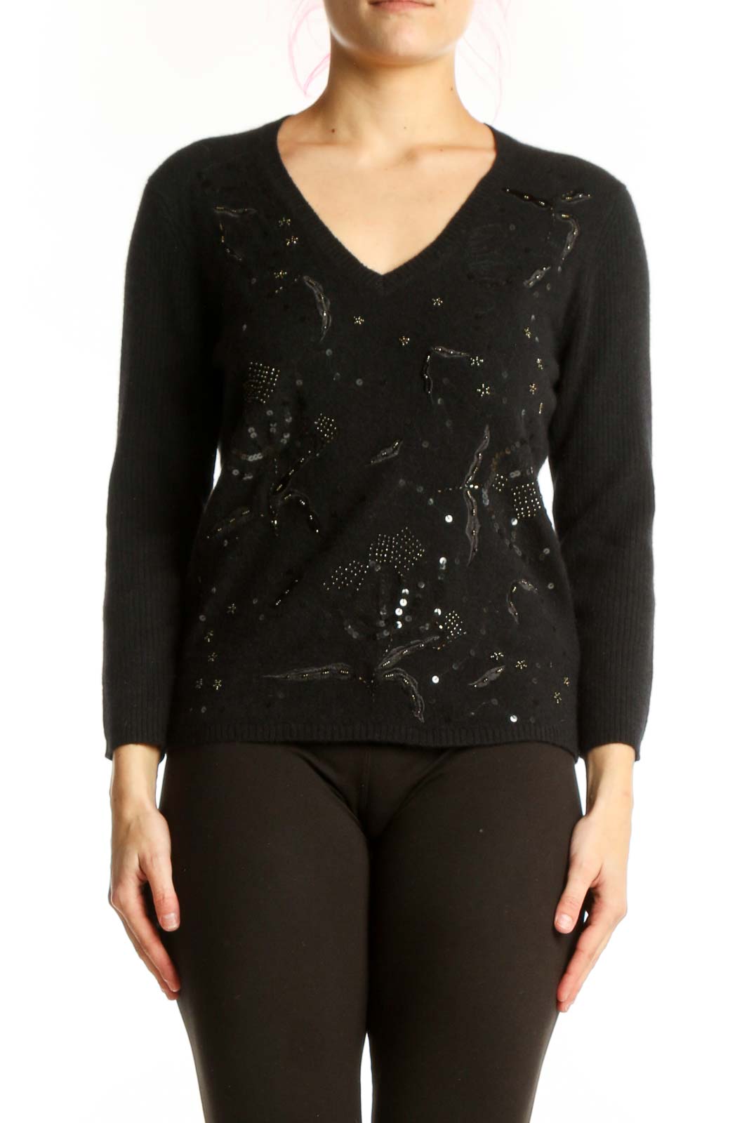 Black embellished merino wool pullover with beadwork and sequin detail, V-neckline, long sleeves, worn with black pants