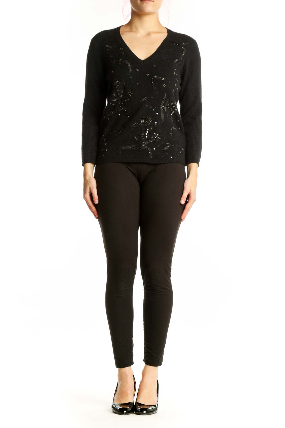Black embellished merino wool pullover with beadwork and sequin detail, V-neckline, long sleeves, worn with black pants