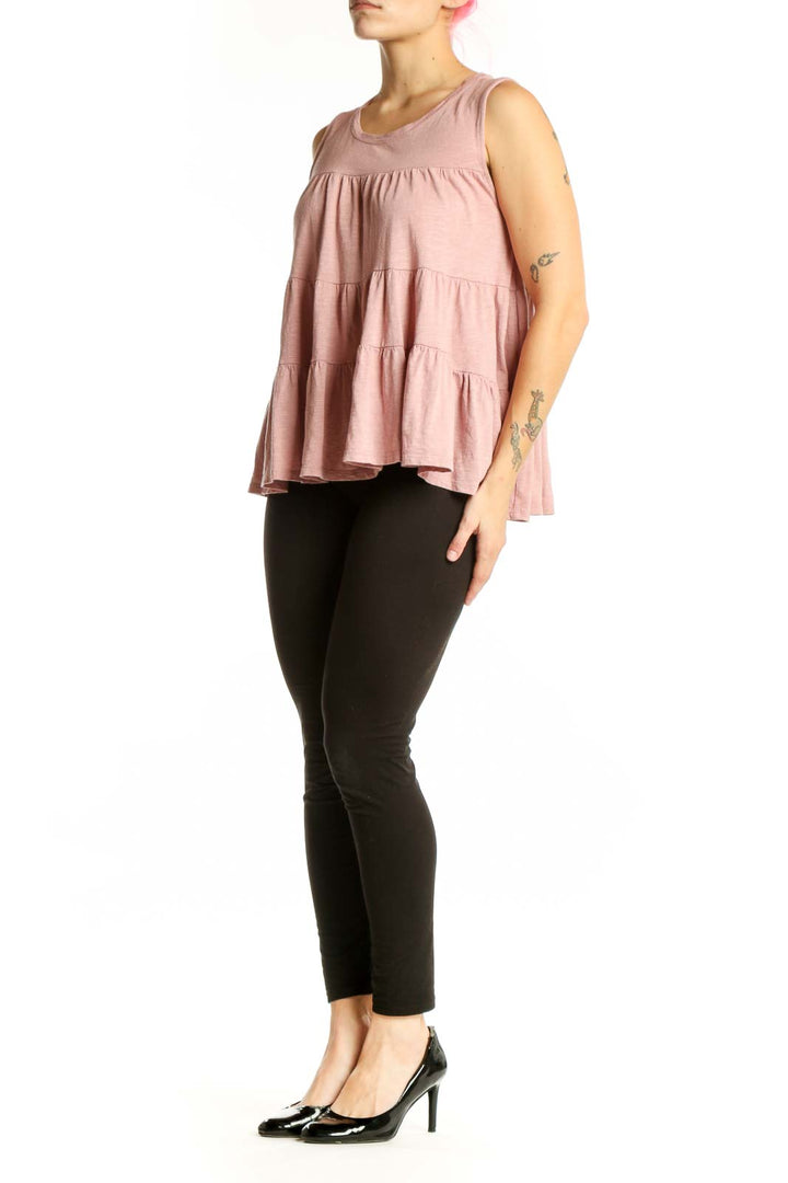 Pink tiered ruffle sleeveless tank top by Everleigh, front view on model